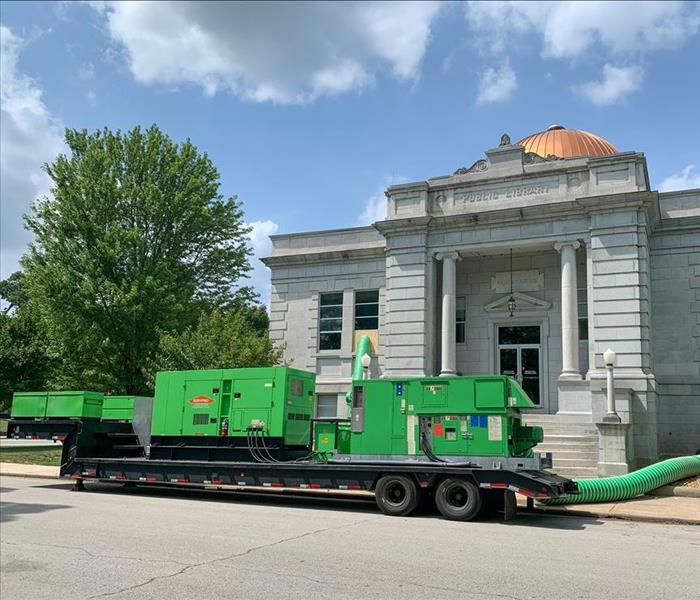 SERVPRO trucks and equipment in front of a library in Carthage, MO